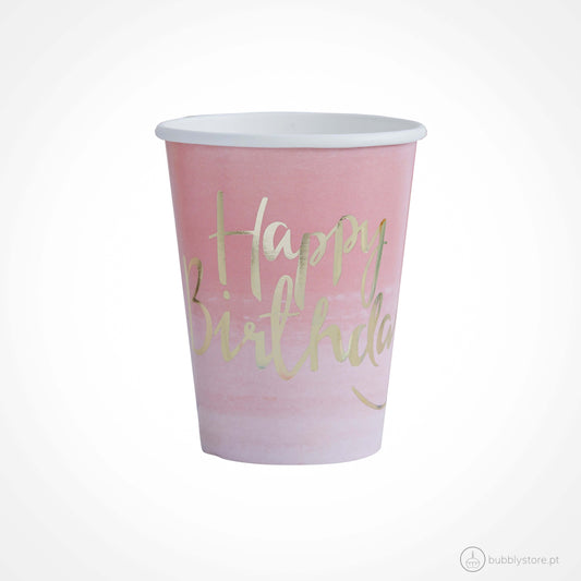 Copos rosa com estampa Happy Birthday dourada, com a capacidade de 260 ml. Disponíveis em conjuntos de 8 unidades.