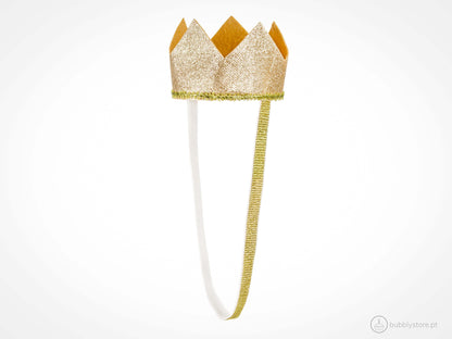 Coroa dourada com glitter, com diâmetro aproximado de 8,5cm. 
Cada embalagem contém 1 unidade.