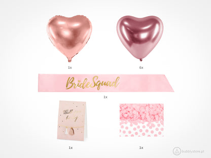 Kit de festa Noiva com 10 peças.
Cada embalagem contém 1 Faixa, 1 Pulseira, 1 balão em forma de coração rosa, 6 balões rose gold e 15gr de confetis.